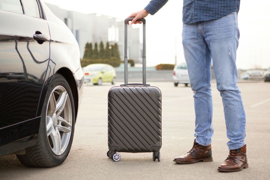 Man waiting at the airport for rental car
